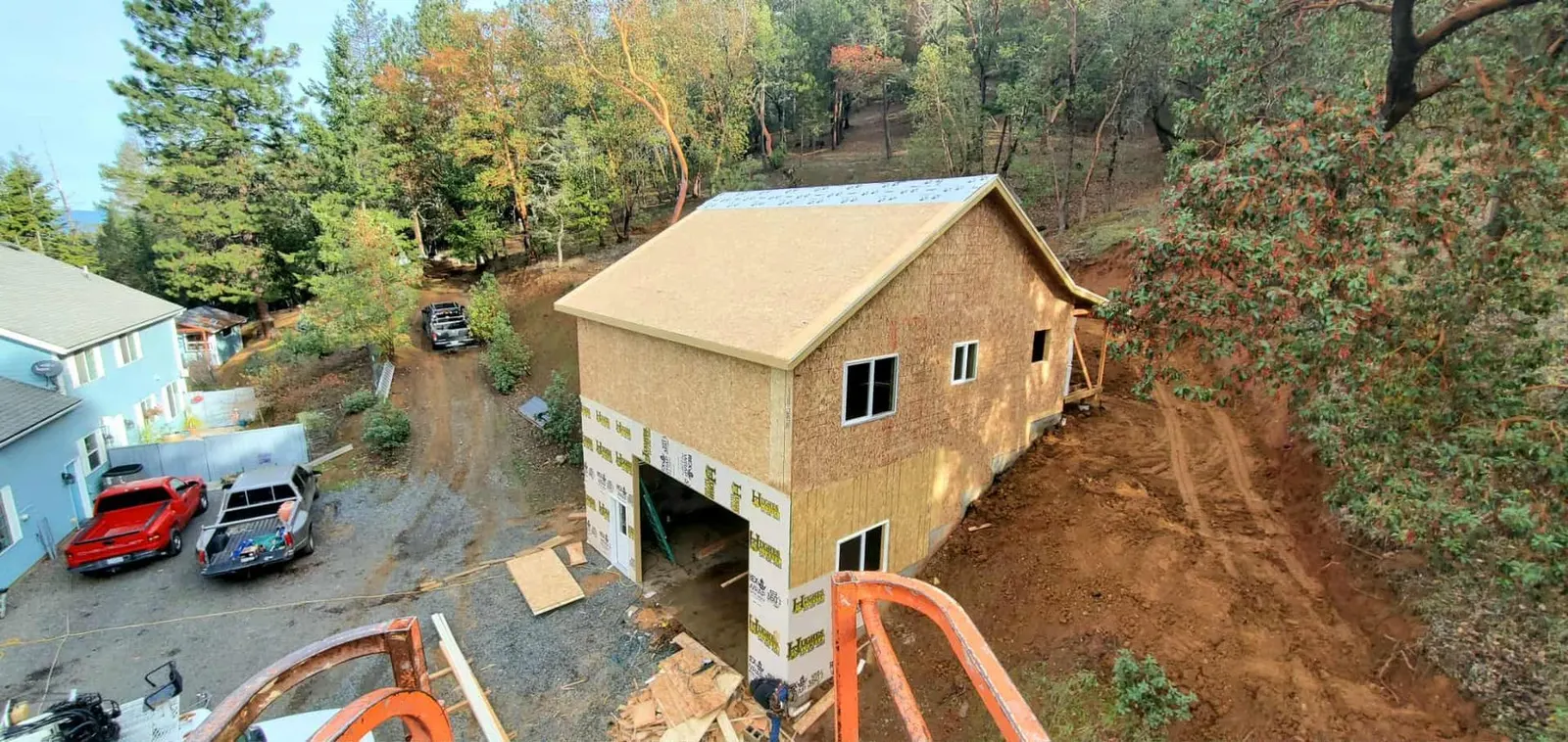 Two-story home under construction with exposed sheathing in the Talent, Oregon area served by Next Gen Contracting