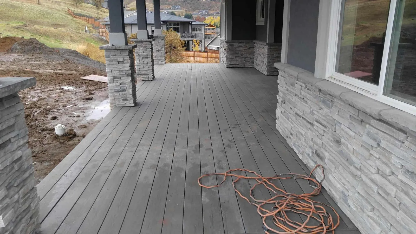 Stacked stone veneer on porch columns and walls of a Southern Oregon home by Next Gen Contracting